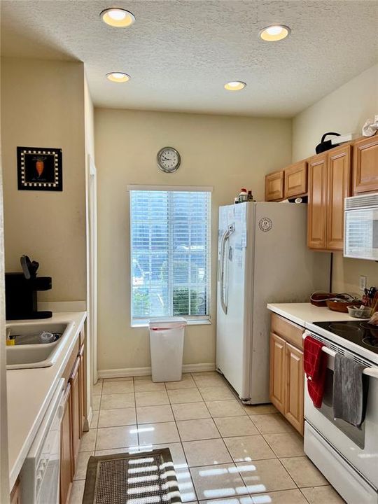 Kitchen includes dishwasher, fridge, stove, microwave and new sink faucet.