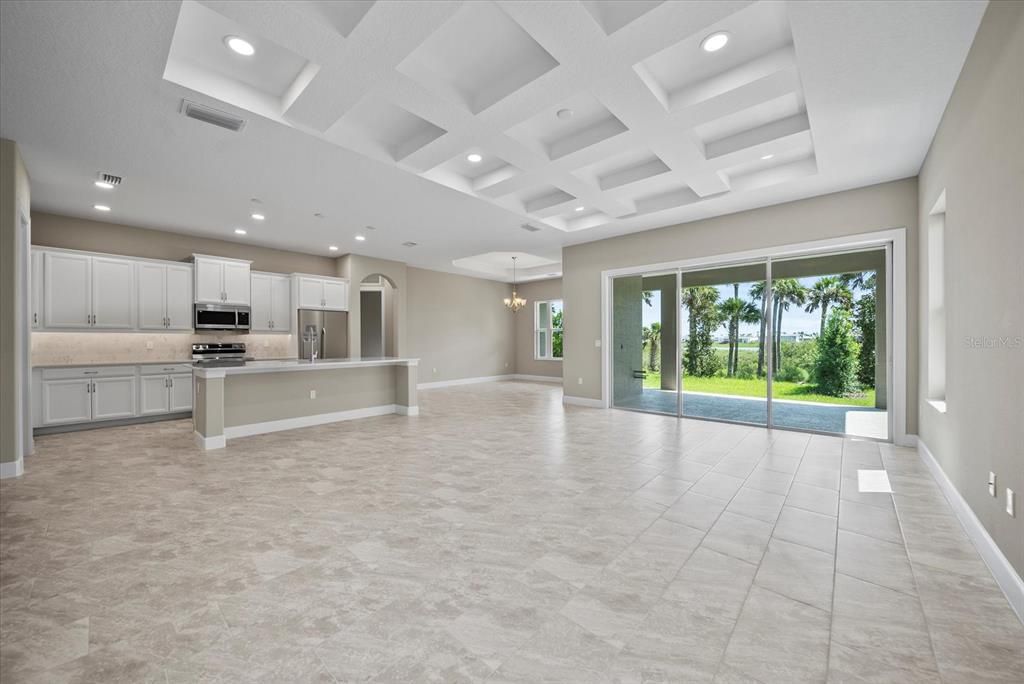 Great room with living, kitchen and dining showcases your peaceful pool area and intracoastal waterway view
