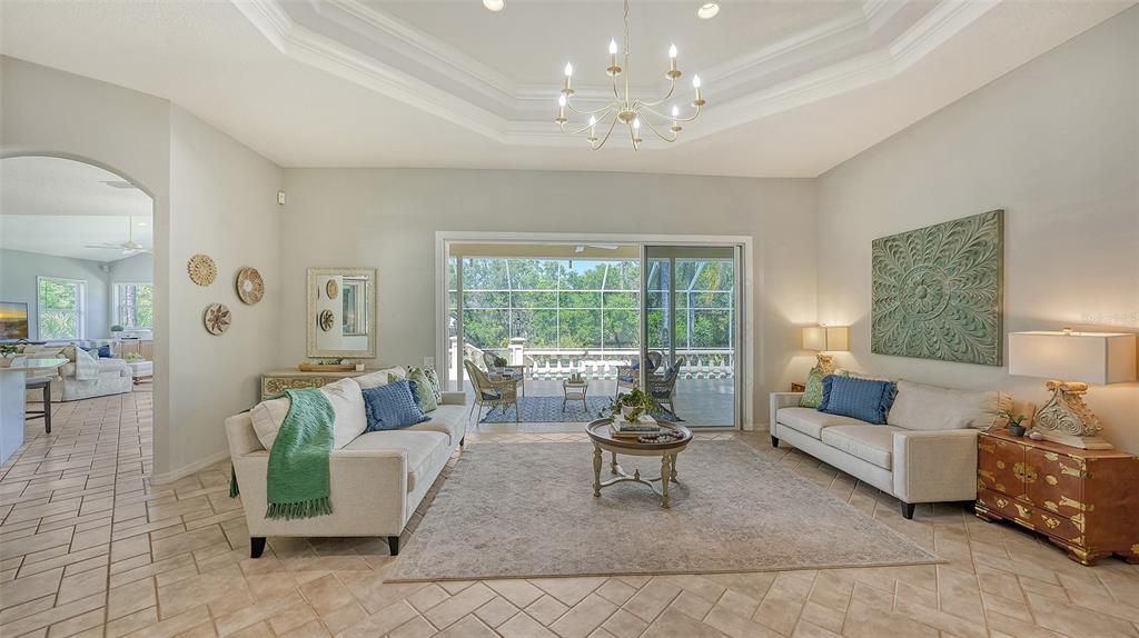 Living room with a view of the preserve and abundant privacy.