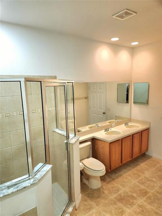 Primary bathroom - shower stall & double sink - 1st fl