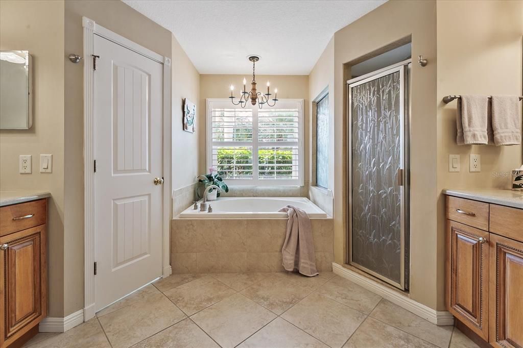 Primary Bath features double sinks, a garden tub, walk-in shower and private water closet
