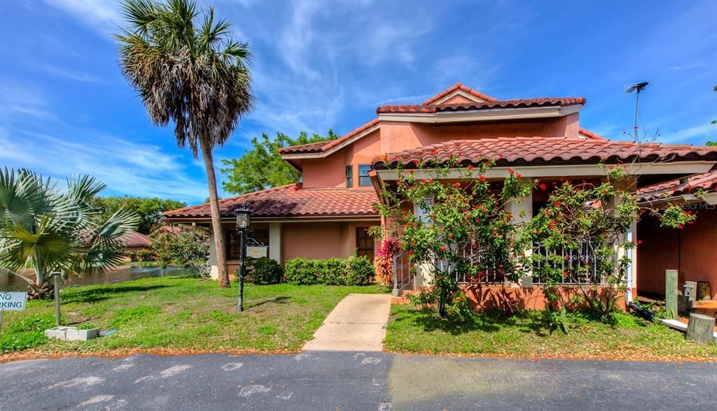 Los Lagos, a community of lovely block and stucco exterior facades complemented by concrete tiled roofs and mature tropical landscaping.