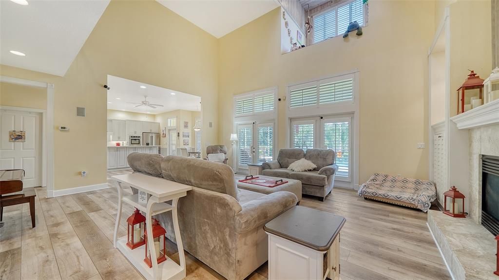 High ceilings, open plan with luxury vinyl plank flooring throughout most of the house.  Gas fireplace, never used and not warranted.  Plantation shutters on the windows and doors