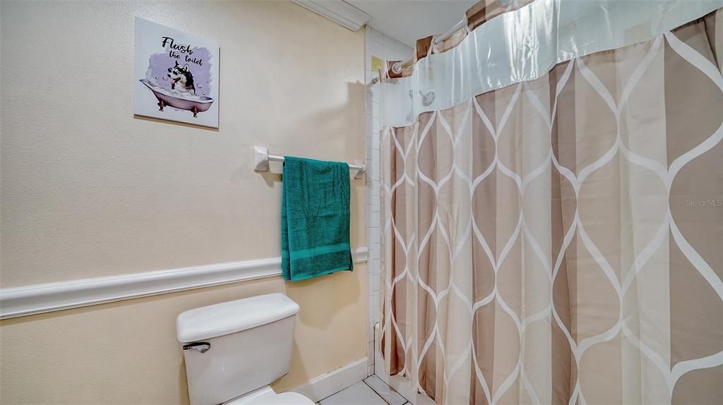 Full Bathroom with shower tub and commode