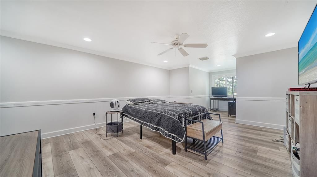 Bedroom 2 upstairs is closest to the full bathroom and has luxury vinyl plank flooring and a walk-in closet