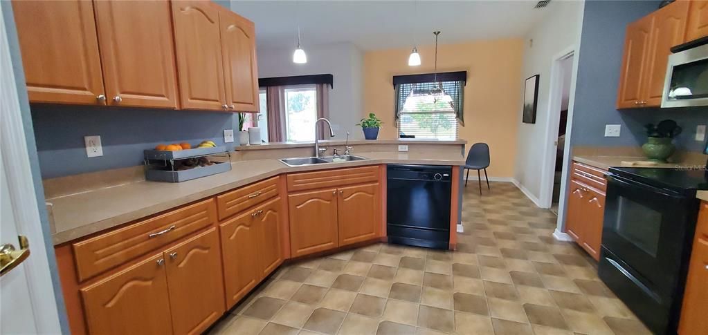 The kitchen has nice cabinets and comes with dishwasher, range, microwave oven above range and refrigerator. Kitchen also has a built in pantry.