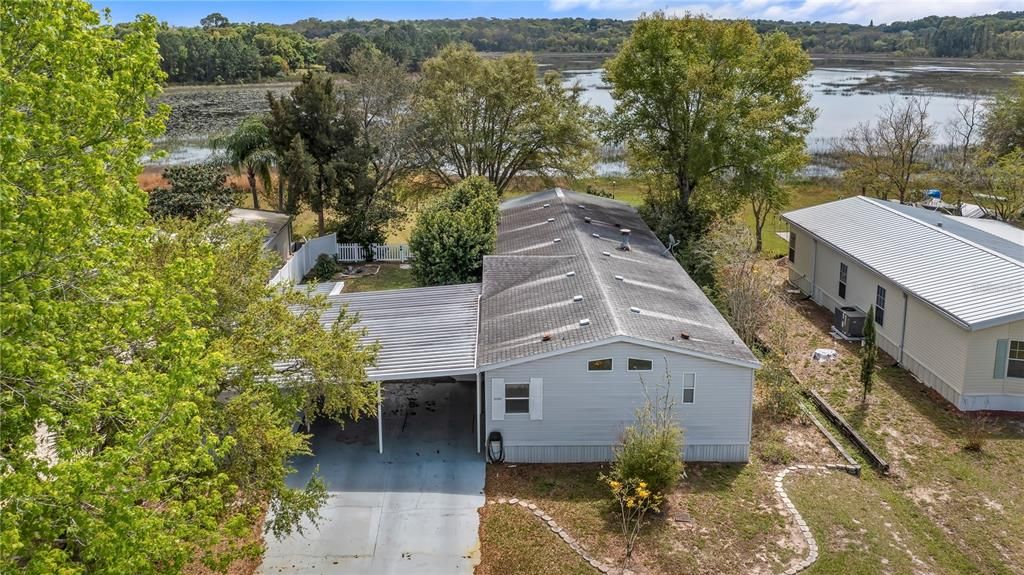 Aerial view of 13205 Plum Lake Cr with Plum Lake in back yard