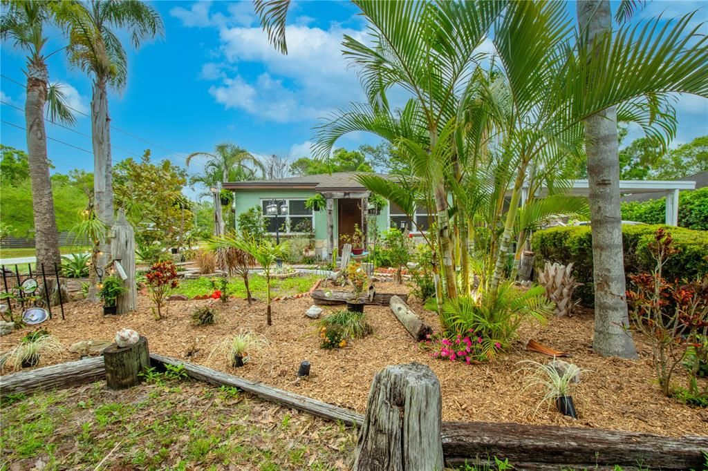 Beautiful corner lot with tropical curb appeal!