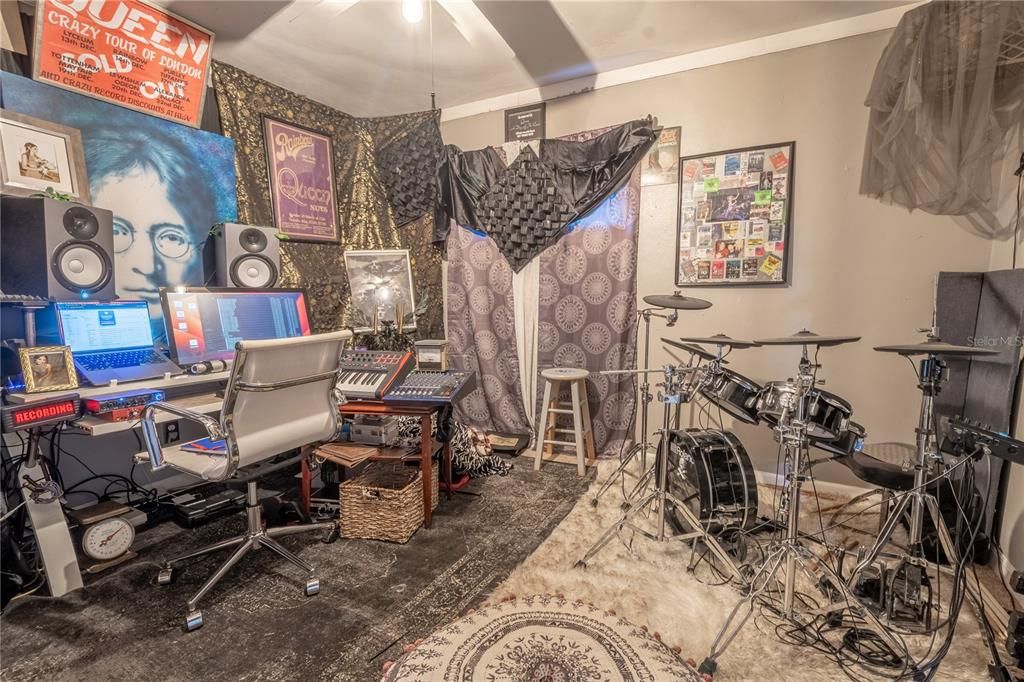 Bedroom 2 is currently serving as the (very talented) homeowners music studio.