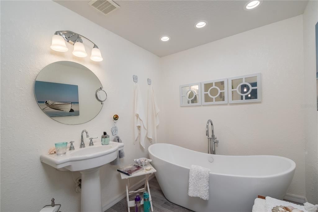 second bathroom with large tub