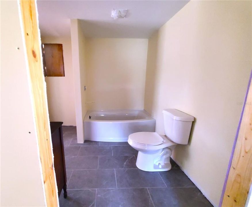 updated floor, tub and toilet