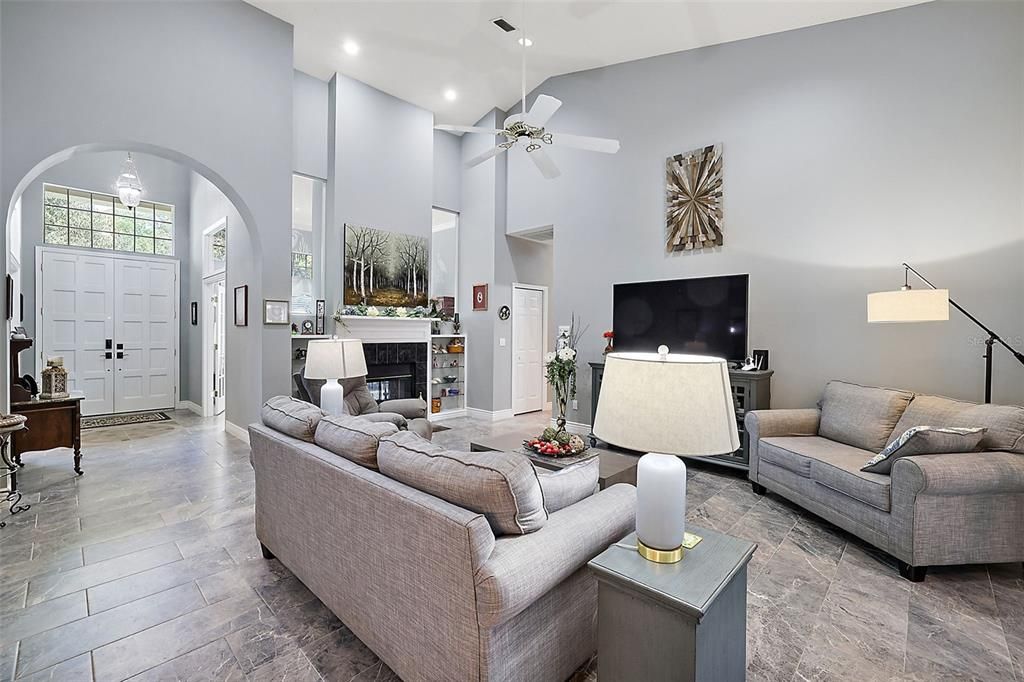 Incredible family room with tile, 2-sided fireplace, and soaring ceilings