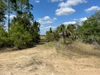 North from this intersection to fifth lot up on left side of road. No SIGN on property.