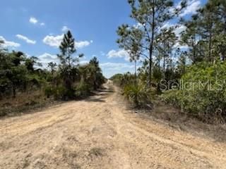 Access from the west to the intersection then turn left and north to the fifth lot up on left side of road access.  No sign. SIGN on property.