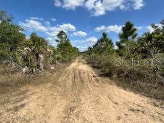 Access from the south and SR74 up 1/2 mile to the intersection and straight ahead to the fifth lot up on left side of road access.  No SIGN on property.