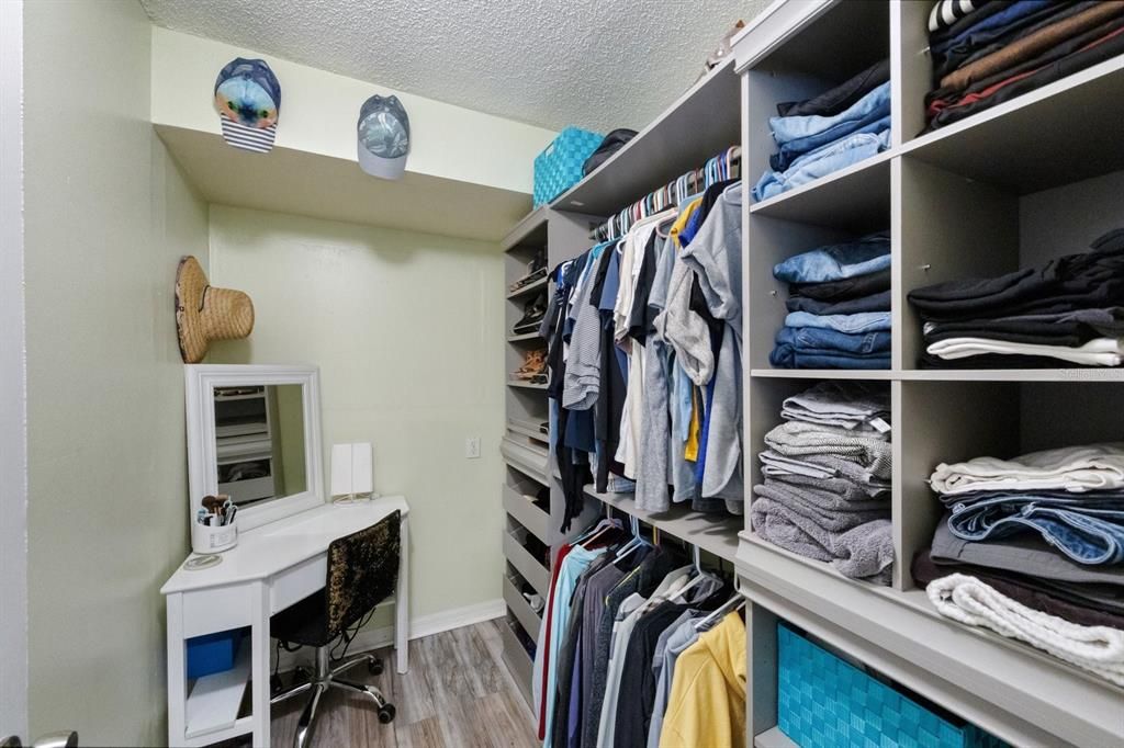 Walk-in closet with custom built in storage shelves