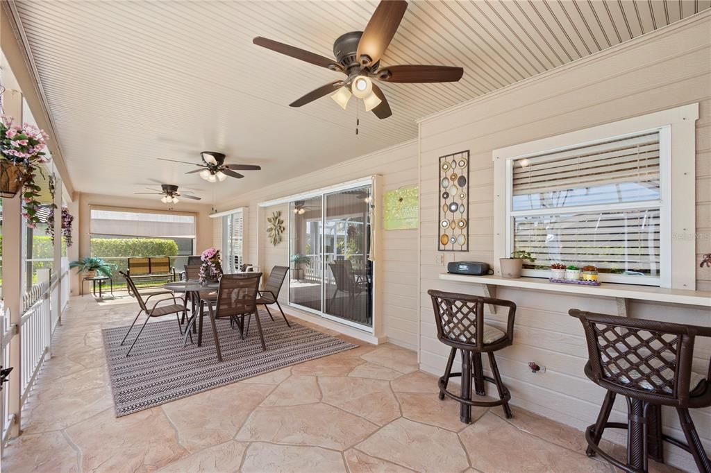 Large Covered and screened lanai that can open up to multiple areas of the home.