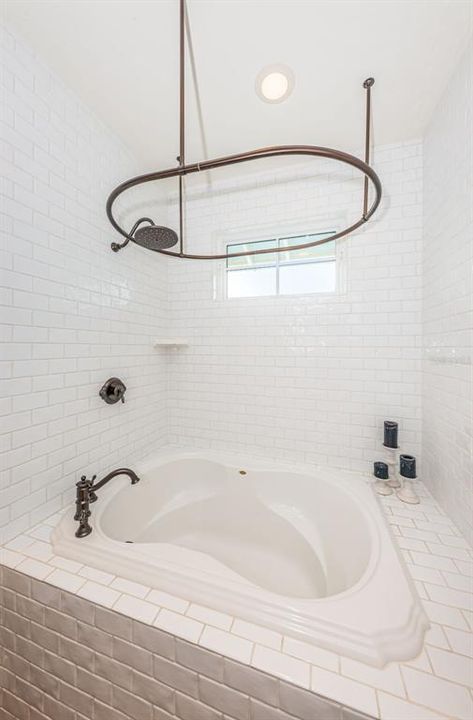 Upstairs Bath 3 with an amazing soaking tub, and oval ceiling shower curtain rod