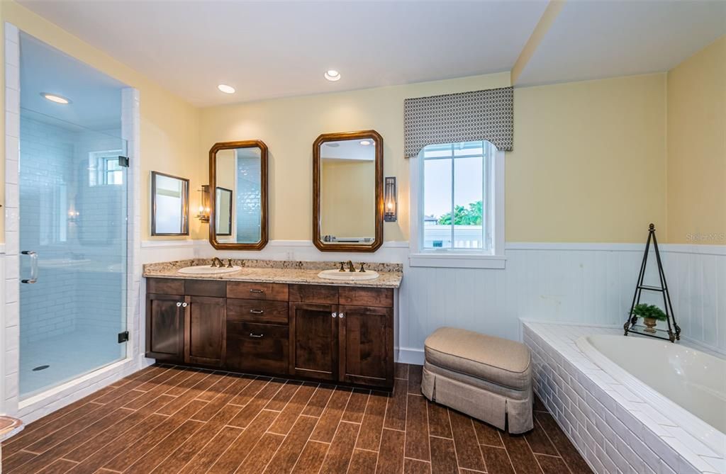 Primary Bath with dual sink vanity, walk-in shower & luxurious soaking tub!