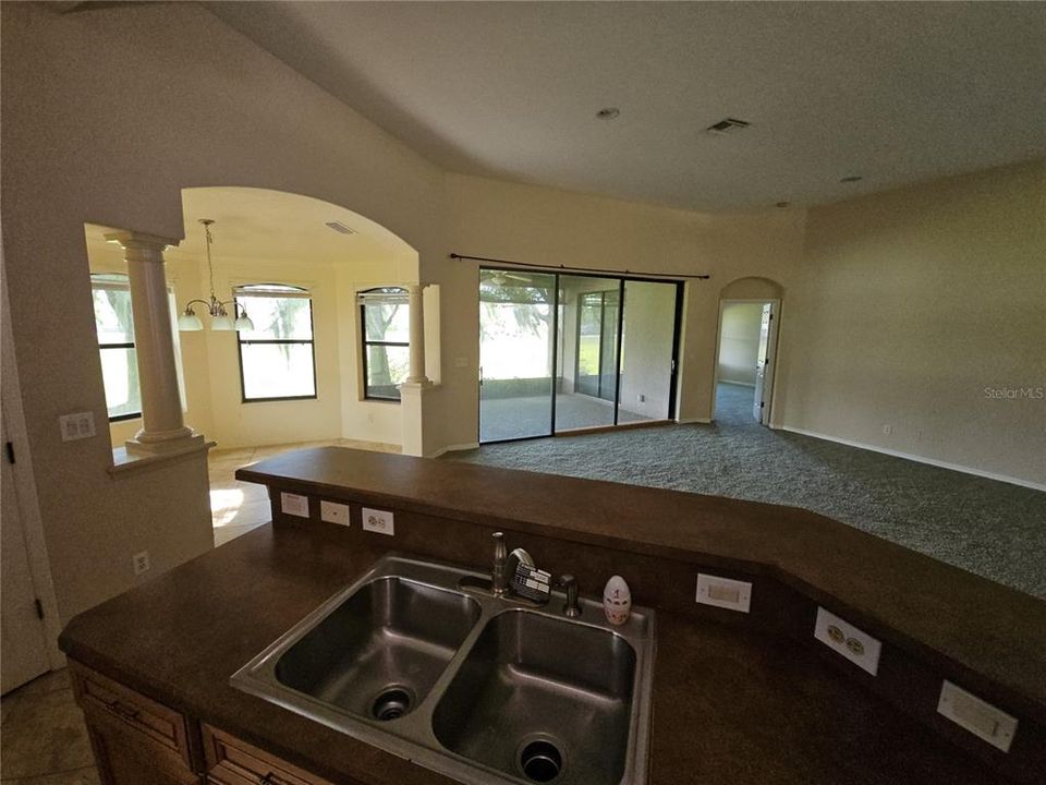 Kitchen Snack Bar overlooks Living Room and takes in all the views of back Lanai and yard.