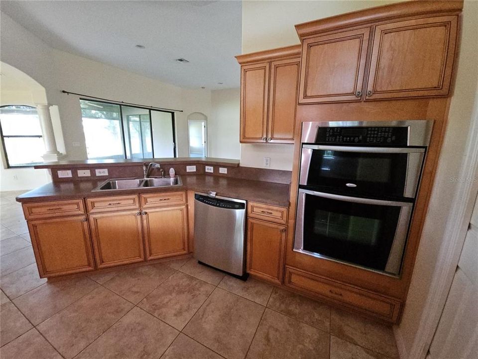 Kitchen is light and bright with views of back Lanai and yard.