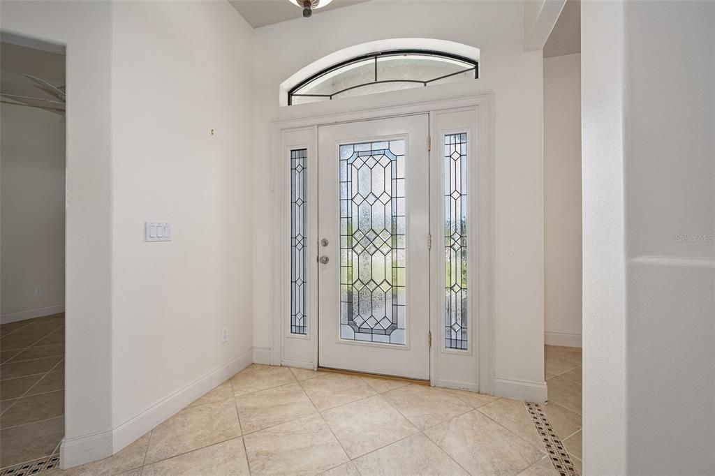 Striking door with sidelights and transom glass