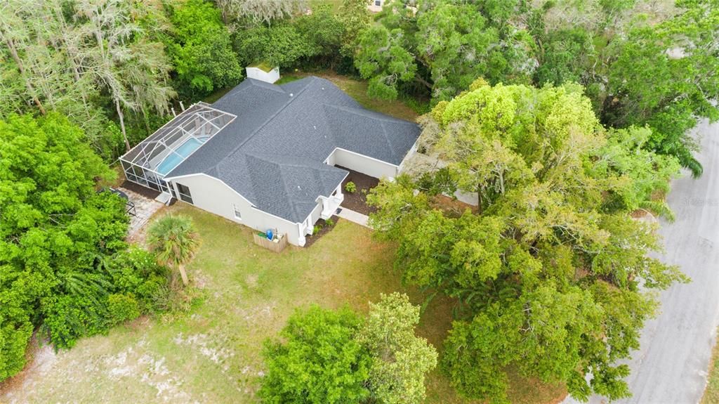 Large side yard and a brick paved patio perfect for enjoying an outdoor fire pit!