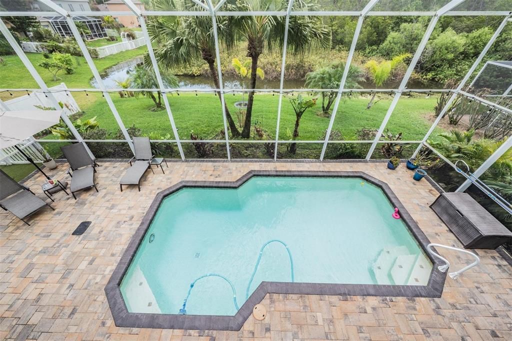 Stunning Pool view, pavered lanai, Conservation and pond lot, along with a fenced in side yard.