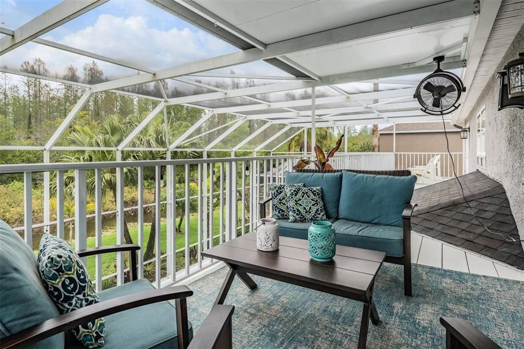 Pavered Lanai, 2nd floor Balcony along the entire upstairs, plenty of covered space for entertaining with electric shades and ceiling fans, private view of the pond and conservation lot.
