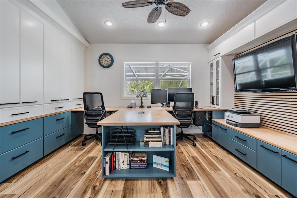 Redesigned bedroom for office space, New water resistant Laminate flooring, custom built-ins for lots of storage, ceiling fan. Completely refreshed with Custom White Oak surfaces and painted storage space.
