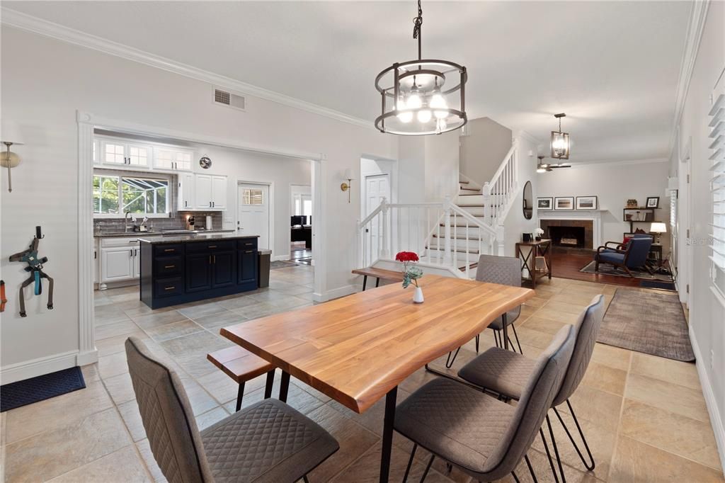 The dining room exudes charm with its plantation shutters and high-quality tile flooring, promising effortless maintenance and a touch of sophistication. Additionally, it features a staircase with a two-way landing pad, designed for optimal efficiency and convenience.