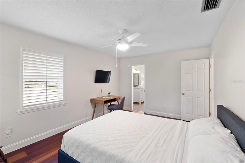 Bedroom 2 showcases engineered hardwood floors and bright walls, providing a blank canvas for any new homeowner to personalize and make their own.
