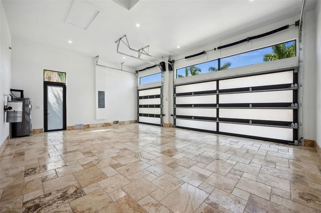 Garage with 13 ft ceilings and tile floor