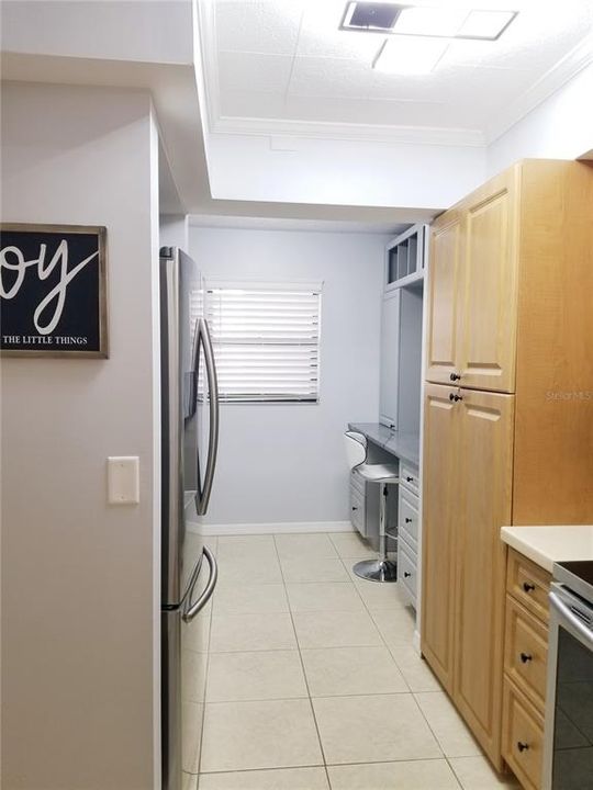 Laundry behind kitchen