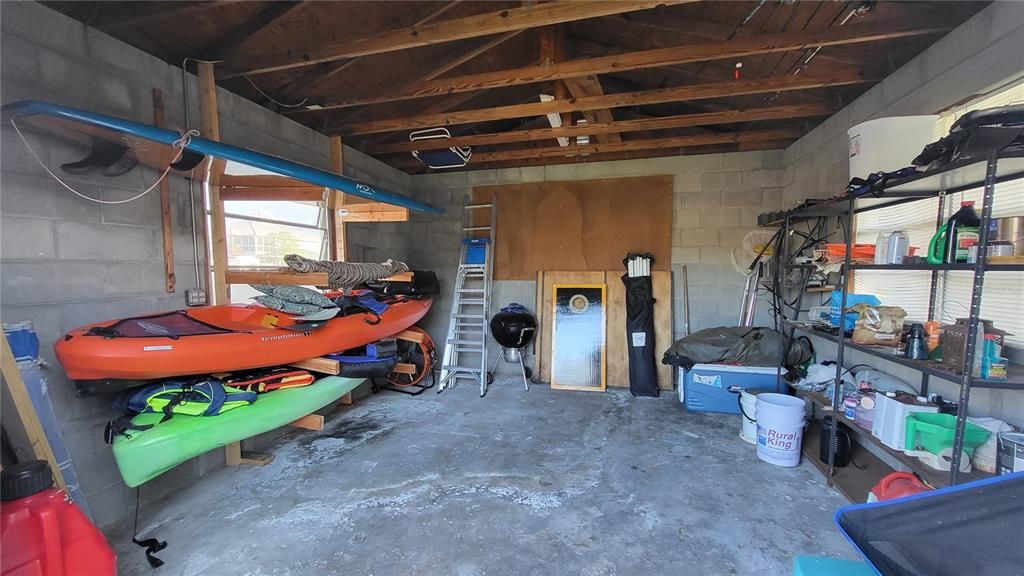 Concrete Storage Shed with Kayak Shelving and plenty of room for a Workshop.