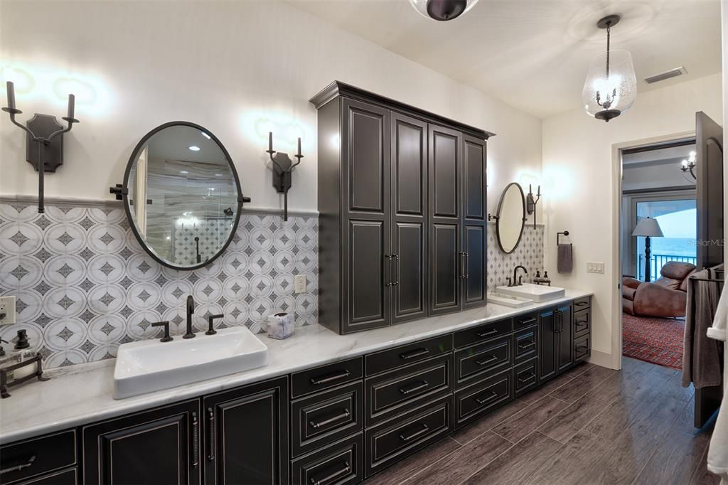 Owner's suite bath with an abundance of storage and double vanities