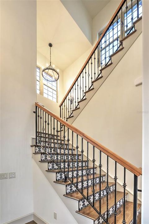 Hand painted tiles adorn the double stairway to the upstairs