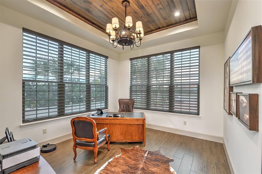 Fourth bedroom or office with coffered wood plank ceiling