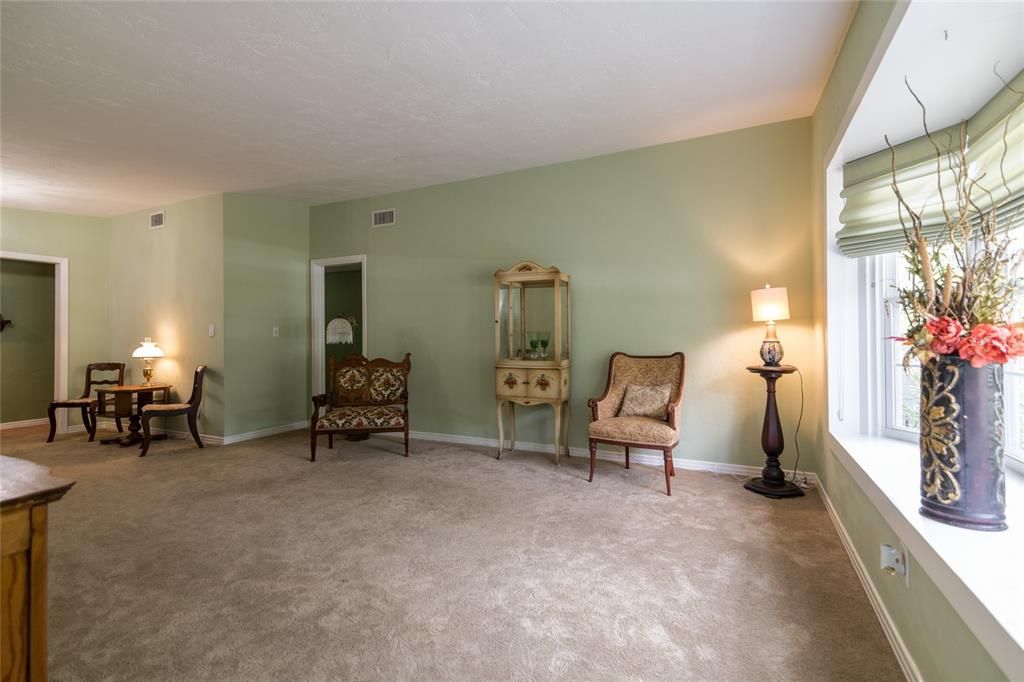 Spacious living/dining room with bay window that brings in lots of natural light!
