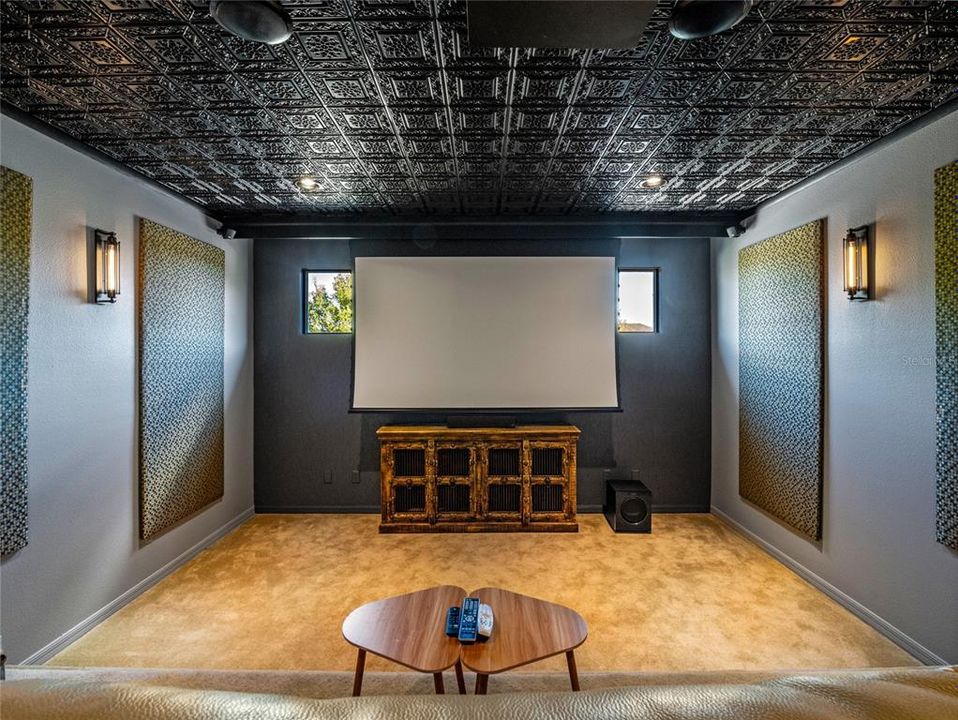 Media Room upstairs with high quality built in speakers, custom ceiling and projector screen