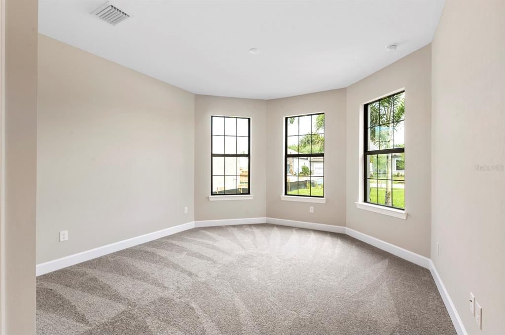 At the front of the home is bedroom suite 2 with carpeted flooring and plenty of natural light.