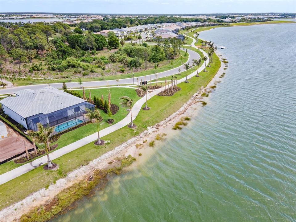 Lakefront and luxurious, this home is an ideal place to live the Florida Lifestyle.