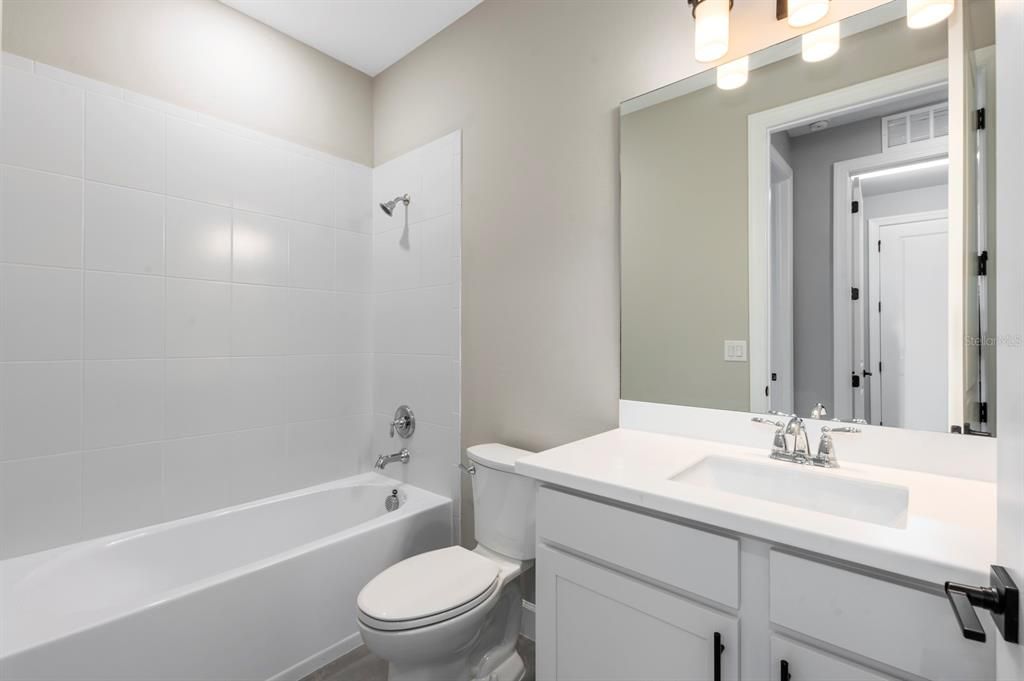 Bathroom 3 is accessible from the hallway and can also be a guest bath.