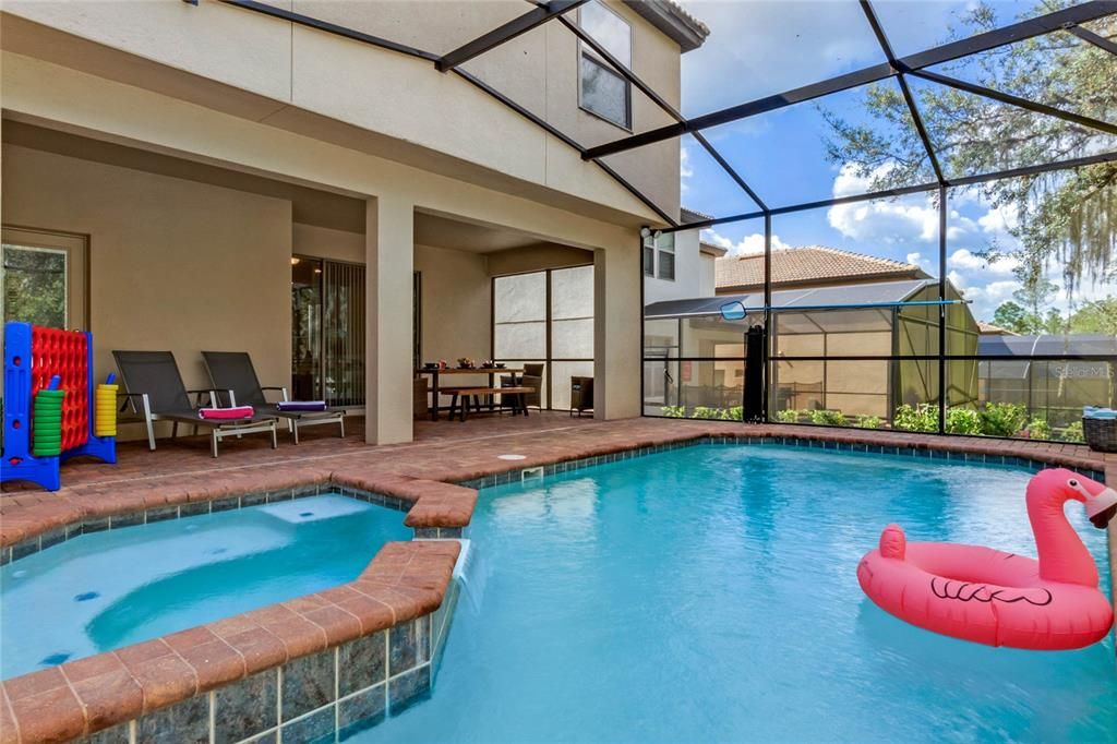 beautiful private pool with hot. lots of shaded seating.