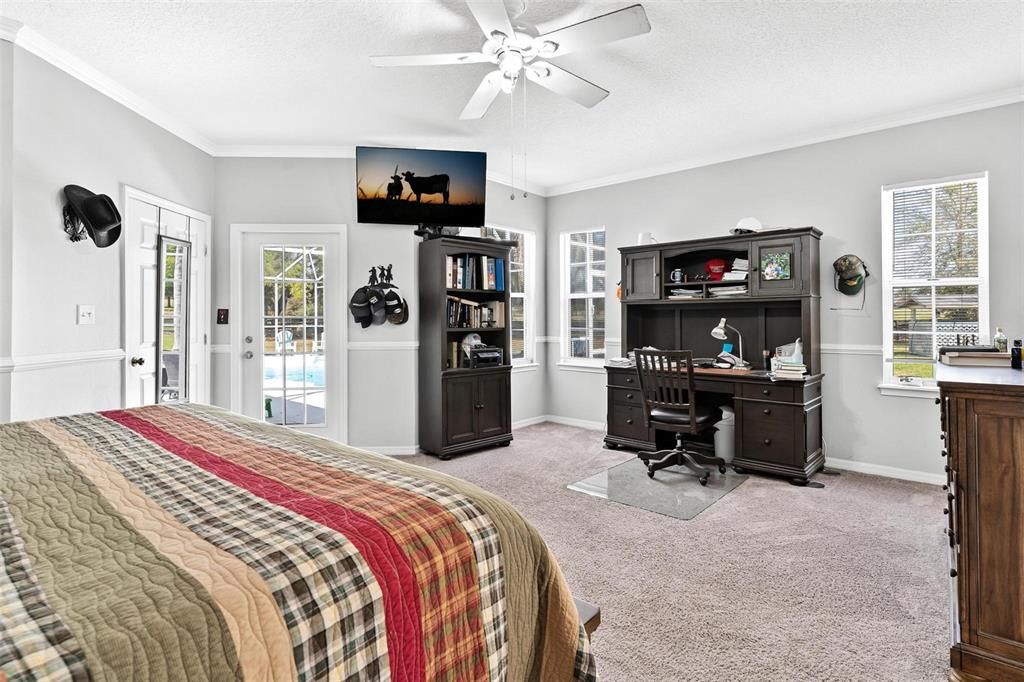 Primary bedroom with entrance to pool area