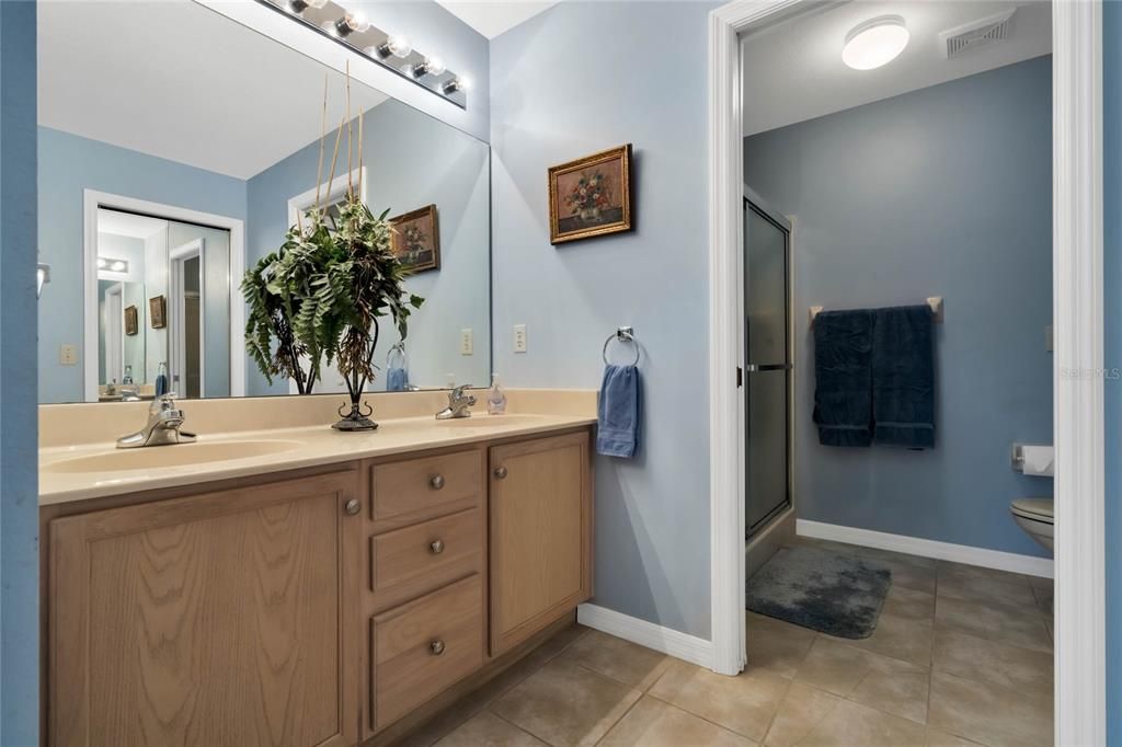 Master Bathroom features a Linen Closet & Water Closet
