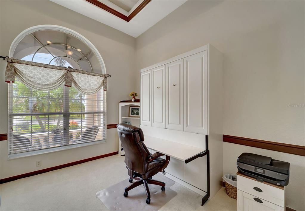 DEN WITH QUEEN MURPHY BED THAT ALSO SERVES AS A WORKING DESK AREA