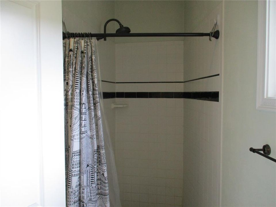 Bathroom tile shower. Unit 230