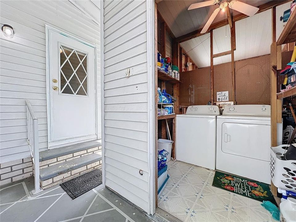 Laundry area is located just a few steps outside kitchen door.