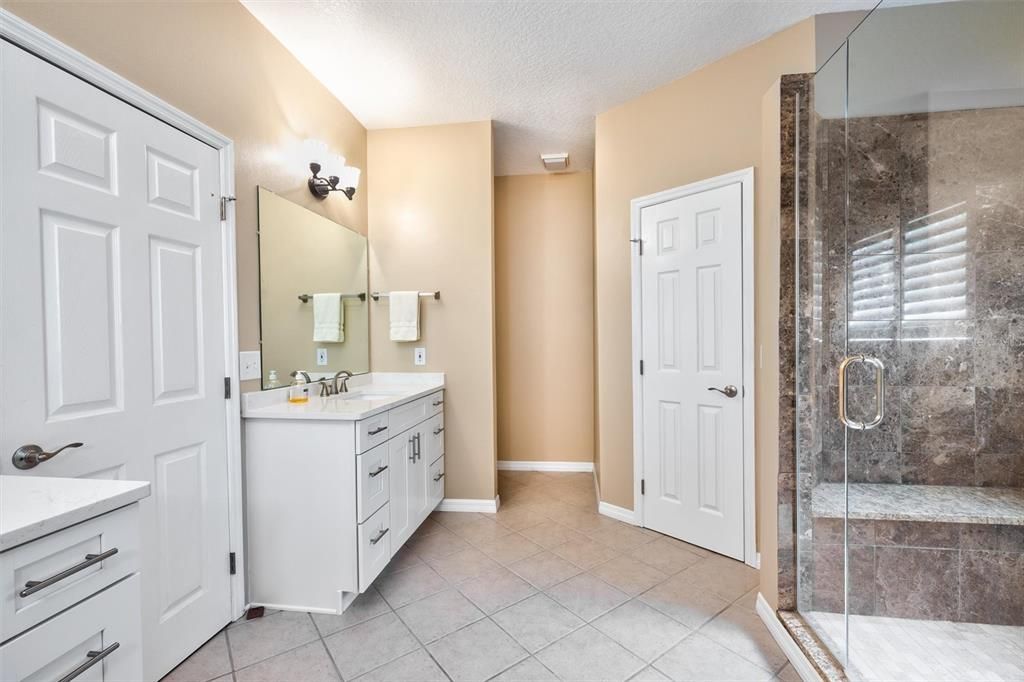 Primary Bathroom with shower bench seat